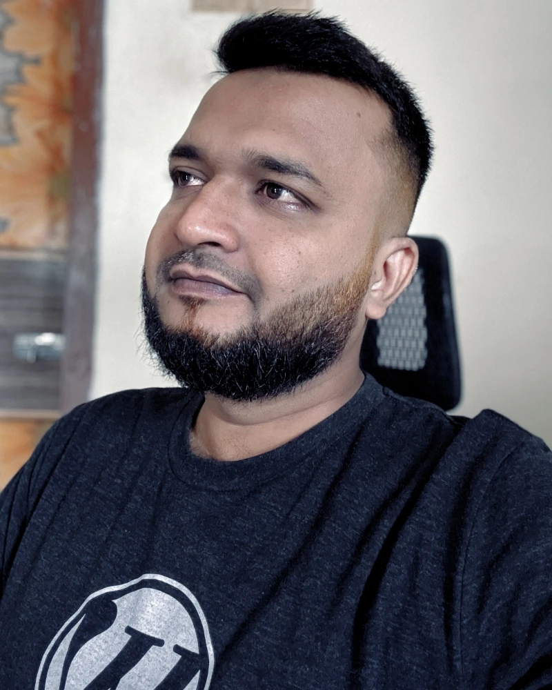 Shameem in a WordPress T-shirt, looking away from the camera
